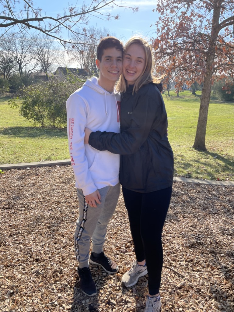 Jade and Juan hugging together in an autumn park