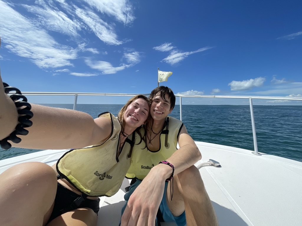 Jade and Juan smiling together on a boat