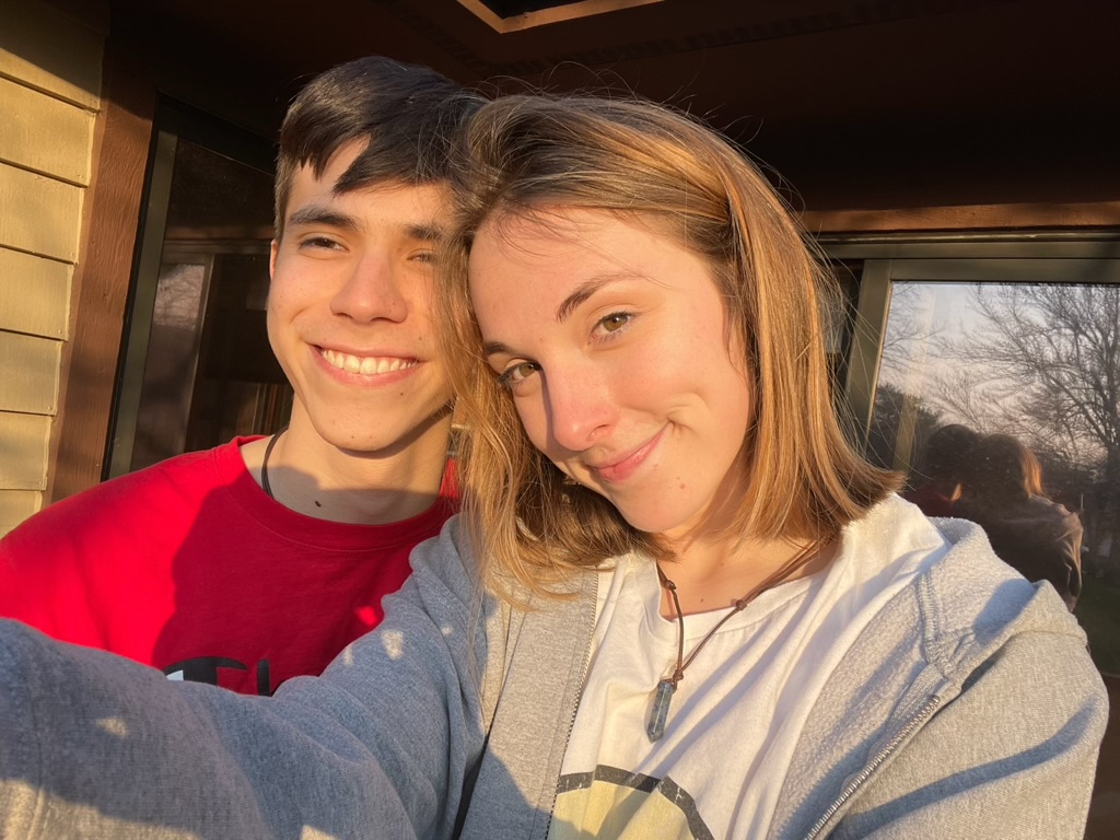 Jade and Juan taking a selfie in golden-hour sunlight