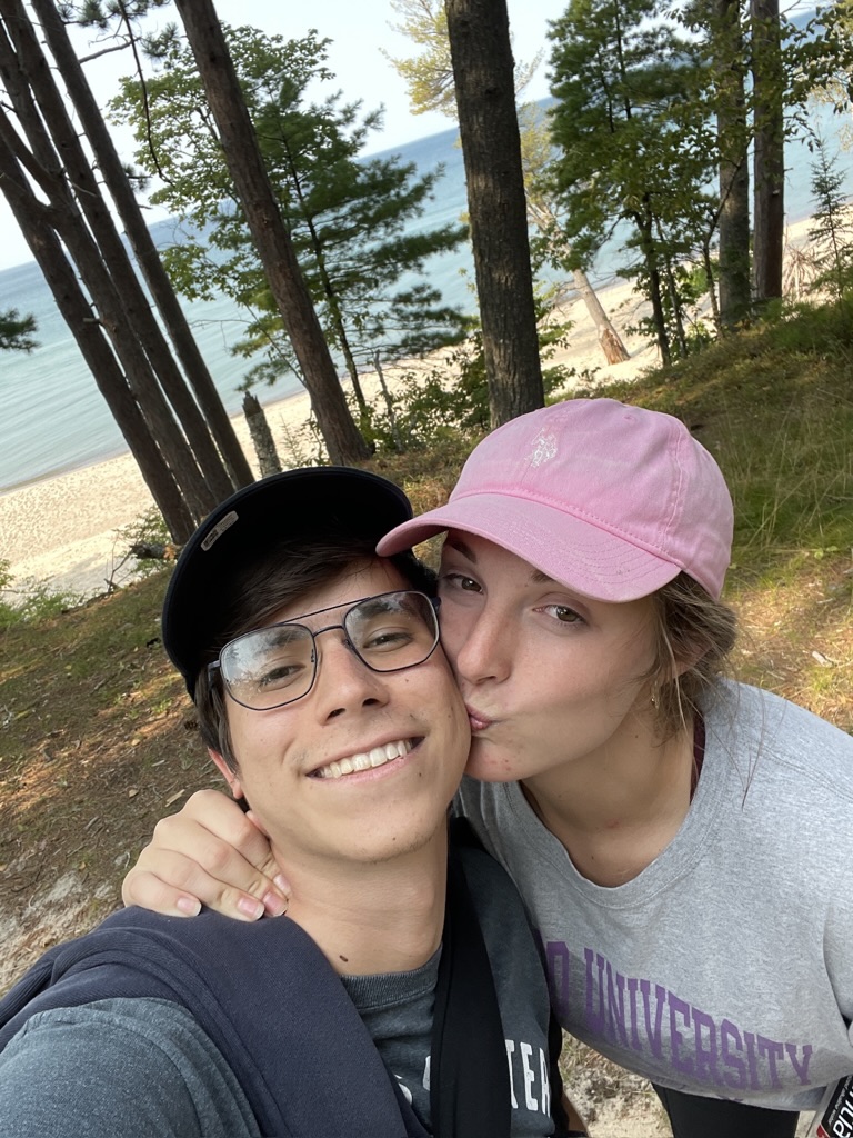 Jade kissing Juan during a lakeside trip