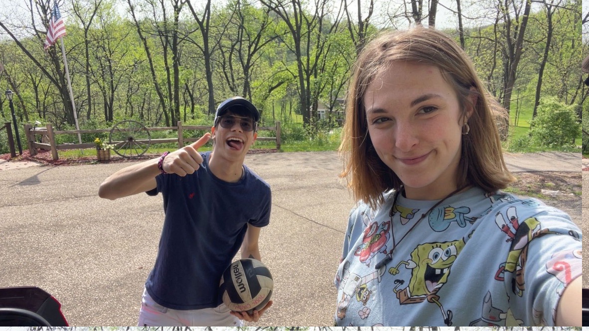 Jade and Juan smiling together before playing volleyball