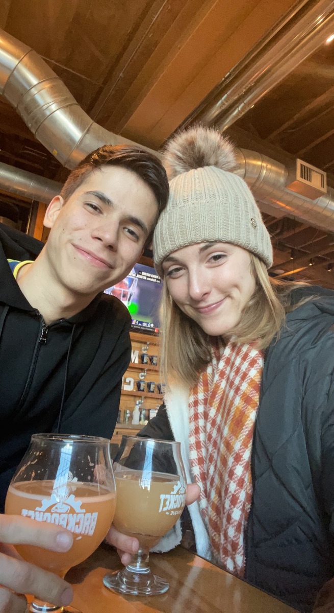 Jade and Juan sharing drinks on a winter outing