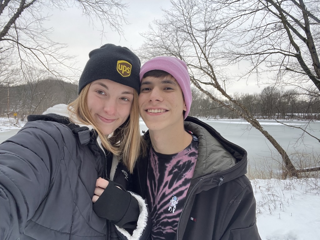 Jade and Juan together beside a frozen winter lake